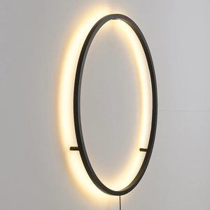 INSPIRA LIFESTYLES – Minimalist Metal Ring Light, a modern circular LED wall light with sleek sculptural design. This versatile wall sconce doubles as accent lighting and wall art, perfect as a bedroom light above a headboard, a living room statement piece, or a minimalist hallway fixture. Contemporary ring light crafted in metal with soft LED illumination, ideal for modern interiors seeking sculptural lighting, circle lights, or functional yet artistic wall sconces.