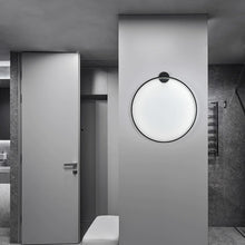 Load image into Gallery viewer, INSPIRA LIFESTYLES – Minimalist Metal Ring Light, a modern circular LED wall light with sleek sculptural design. This versatile wall sconce doubles as accent lighting and wall art, perfect as a bedroom light above a headboard, a living room statement piece, or a minimalist hallway fixture. Contemporary ring light crafted in metal with soft LED illumination, ideal for modern interiors seeking sculptural lighting, circle lights, or functional yet artistic wall sconces.
