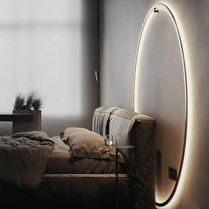 INSPIRA LIFESTYLES – Minimalist Metal Ring Light, a modern circular LED wall light with sleek sculptural design. This versatile wall sconce doubles as accent lighting and wall art, perfect as a bedroom light above a headboard, a living room statement piece, or a minimalist hallway fixture. Contemporary ring light crafted in metal with soft LED illumination, ideal for modern interiors seeking sculptural lighting, circle lights, or functional yet artistic wall sconces.