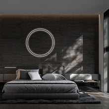 Load image into Gallery viewer, INSPIRA LIFESTYLES – Minimalist Metal Ring Light, a modern circular LED wall light with sleek sculptural design. This versatile wall sconce doubles as accent lighting and wall art, perfect as a bedroom light above a headboard, a living room statement piece, or a minimalist hallway fixture. Contemporary ring light crafted in metal with soft LED illumination, ideal for modern interiors seeking sculptural lighting, circle lights, or functional yet artistic wall sconces.
