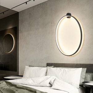 INSPIRA LIFESTYLES – Minimalist Metal Ring Light, a modern circular LED wall light with sleek sculptural design. This versatile wall sconce doubles as accent lighting and wall art, perfect as a bedroom light above a headboard, a living room statement piece, or a minimalist hallway fixture. Contemporary ring light crafted in metal with soft LED illumination, ideal for modern interiors seeking sculptural lighting, circle lights, or functional yet artistic wall sconces.
