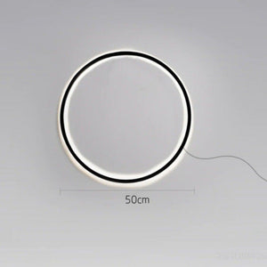 INSPIRA LIFESTYLES – Minimalist Metal Ring Light, a modern circular LED wall light with sleek sculptural design. This versatile wall sconce doubles as accent lighting and wall art, perfect as a bedroom light above a headboard, a living room statement piece, or a minimalist hallway fixture. Contemporary ring light crafted in metal with soft LED illumination, ideal for modern interiors seeking sculptural lighting, circle lights, or functional yet artistic wall sconces.