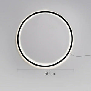 INSPIRA LIFESTYLES – Minimalist Metal Ring Light, a modern circular LED wall light with sleek sculptural design. This versatile wall sconce doubles as accent lighting and wall art, perfect as a bedroom light above a headboard, a living room statement piece, or a minimalist hallway fixture. Contemporary ring light crafted in metal with soft LED illumination, ideal for modern interiors seeking sculptural lighting, circle lights, or functional yet artistic wall sconces.