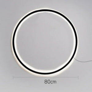 INSPIRA LIFESTYLES – Minimalist Metal Ring Light, a modern circular LED wall light with sleek sculptural design. This versatile wall sconce doubles as accent lighting and wall art, perfect as a bedroom light above a headboard, a living room statement piece, or a minimalist hallway fixture. Contemporary ring light crafted in metal with soft LED illumination, ideal for modern interiors seeking sculptural lighting, circle lights, or functional yet artistic wall sconces.