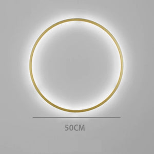 INSPIRA LIFESTYLES – Minimalist Metal Ring Light, a modern circular LED wall light with sleek sculptural design. This versatile wall sconce doubles as accent lighting and wall art, perfect as a bedroom light above a headboard, a living room statement piece, or a minimalist hallway fixture. Contemporary ring light crafted in metal with soft LED illumination, ideal for modern interiors seeking sculptural lighting, circle lights, or functional yet artistic wall sconces.