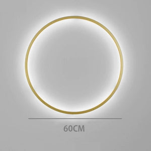 INSPIRA LIFESTYLES – Minimalist Metal Ring Light, a modern circular LED wall light with sleek sculptural design. This versatile wall sconce doubles as accent lighting and wall art, perfect as a bedroom light above a headboard, a living room statement piece, or a minimalist hallway fixture. Contemporary ring light crafted in metal with soft LED illumination, ideal for modern interiors seeking sculptural lighting, circle lights, or functional yet artistic wall sconces.