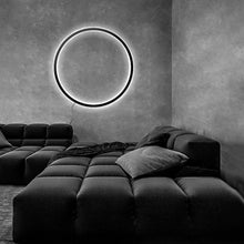 Load image into Gallery viewer, INSPIRA LIFESTYLES – Minimalist Metal Ring Light, a modern circular LED wall light with sleek sculptural design. This versatile wall sconce doubles as accent lighting and wall art, perfect as a bedroom light above a headboard, a living room statement piece, or a minimalist hallway fixture. Contemporary ring light crafted in metal with soft LED illumination, ideal for modern interiors seeking sculptural lighting, circle lights, or functional yet artistic wall sconces.
