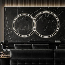Load image into Gallery viewer, INSPIRA LIFESTYLES – Minimalist Metal Ring Light, a modern circular LED wall light with sleek sculptural design. This versatile wall sconce doubles as accent lighting and wall art, perfect as a bedroom light above a headboard, a living room statement piece, or a minimalist hallway fixture. Contemporary ring light crafted in metal with soft LED illumination, ideal for modern interiors seeking sculptural lighting, circle lights, or functional yet artistic wall sconces.
