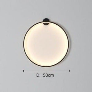 INSPIRA LIFESTYLES – Minimalist Metal Ring Light, a modern circular LED wall light with sleek sculptural design. This versatile wall sconce doubles as accent lighting and wall art, perfect as a bedroom light above a headboard, a living room statement piece, or a minimalist hallway fixture. Contemporary ring light crafted in metal with soft LED illumination, ideal for modern interiors seeking sculptural lighting, circle lights, or functional yet artistic wall sconces.