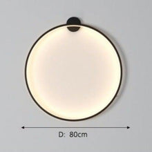 Load image into Gallery viewer, INSPIRA LIFESTYLES – Minimalist Metal Ring Light, a modern circular LED wall light with sleek sculptural design. This versatile wall sconce doubles as accent lighting and wall art, perfect as a bedroom light above a headboard, a living room statement piece, or a minimalist hallway fixture. Contemporary ring light crafted in metal with soft LED illumination, ideal for modern interiors seeking sculptural lighting, circle lights, or functional yet artistic wall sconces.
