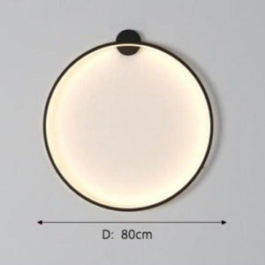 INSPIRA LIFESTYLES – Minimalist Metal Ring Light, a modern circular LED wall light with sleek sculptural design. This versatile wall sconce doubles as accent lighting and wall art, perfect as a bedroom light above a headboard, a living room statement piece, or a minimalist hallway fixture. Contemporary ring light crafted in metal with soft LED illumination, ideal for modern interiors seeking sculptural lighting, circle lights, or functional yet artistic wall sconces.