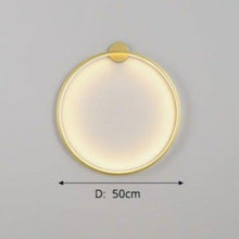 Load image into Gallery viewer, INSPIRA LIFESTYLES – Minimalist Metal Ring Light, a modern circular LED wall light with sleek sculptural design. This versatile wall sconce doubles as accent lighting and wall art, perfect as a bedroom light above a headboard, a living room statement piece, or a minimalist hallway fixture. Contemporary ring light crafted in metal with soft LED illumination, ideal for modern interiors seeking sculptural lighting, circle lights, or functional yet artistic wall sconces.
