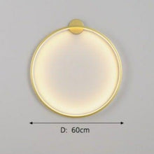 Load image into Gallery viewer, INSPIRA LIFESTYLES – Minimalist Metal Ring Light, a modern circular LED wall light with sleek sculptural design. This versatile wall sconce doubles as accent lighting and wall art, perfect as a bedroom light above a headboard, a living room statement piece, or a minimalist hallway fixture. Contemporary ring light crafted in metal with soft LED illumination, ideal for modern interiors seeking sculptural lighting, circle lights, or functional yet artistic wall sconces.

