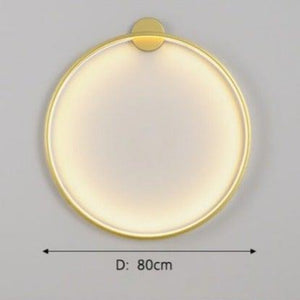 INSPIRA LIFESTYLES – Minimalist Metal Ring Light, a modern circular LED wall light with sleek sculptural design. This versatile wall sconce doubles as accent lighting and wall art, perfect as a bedroom light above a headboard, a living room statement piece, or a minimalist hallway fixture. Contemporary ring light crafted in metal with soft LED illumination, ideal for modern interiors seeking sculptural lighting, circle lights, or functional yet artistic wall sconces.