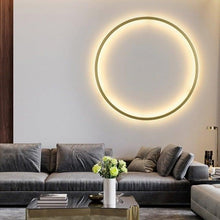 Load image into Gallery viewer, INSPIRA LIFESTYLES – Minimalist Metal Ring Light, a modern circular LED wall light with sleek sculptural design. This versatile wall sconce doubles as accent lighting and wall art, perfect as a bedroom light above a headboard, a living room statement piece, or a minimalist hallway fixture. Contemporary ring light crafted in metal with soft LED illumination, ideal for modern interiors seeking sculptural lighting, circle lights, or functional yet artistic wall sconces.
