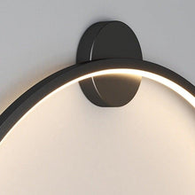 Load image into Gallery viewer, INSPIRA LIFESTYLES – Minimalist Metal Ring Light, a modern circular LED wall light with sleek sculptural design. This versatile wall sconce doubles as accent lighting and wall art, perfect as a bedroom light above a headboard, a living room statement piece, or a minimalist hallway fixture. Contemporary ring light crafted in metal with soft LED illumination, ideal for modern interiors seeking sculptural lighting, circle lights, or functional yet artistic wall sconces.
