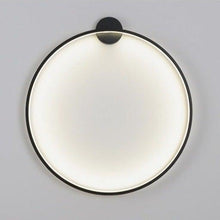 Load image into Gallery viewer, INSPIRA LIFESTYLES – Minimalist Metal Ring Light, a modern circular LED wall light with sleek sculptural design. This versatile wall sconce doubles as accent lighting and wall art, perfect as a bedroom light above a headboard, a living room statement piece, or a minimalist hallway fixture. Contemporary ring light crafted in metal with soft LED illumination, ideal for modern interiors seeking sculptural lighting, circle lights, or functional yet artistic wall sconces.
