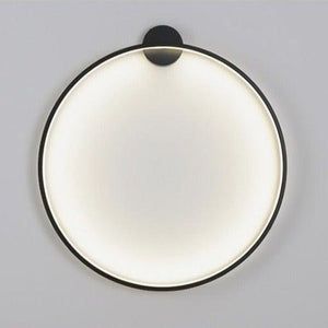 INSPIRA LIFESTYLES – Minimalist Metal Ring Light, a modern circular LED wall light with sleek sculptural design. This versatile wall sconce doubles as accent lighting and wall art, perfect as a bedroom light above a headboard, a living room statement piece, or a minimalist hallway fixture. Contemporary ring light crafted in metal with soft LED illumination, ideal for modern interiors seeking sculptural lighting, circle lights, or functional yet artistic wall sconces.