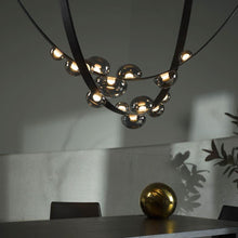 Load image into Gallery viewer, INSPIRA LIFESTYLES - Strapped Chandelier - ABSTRACT LIGHT, ACCENT LIGHT, BEDROOM LIGHT, BOARDROOM LIGHT, CHANDELIER, DINING LIGHT, FEATURE LIGHT, GLASS GLOBE CHANDELIER, GLOBE CHANDELIER, GLOBE LIGHT, HANGING LIGHT, HOTEL LIGHT, LEATHER STRAP LIGHT, LED CHANDELIER, LED LIGHT, LIGHT, LIGHT FIXTURE, LIGHTING, LIGHTS, LIVING ROOM LIGHT, MINIMAL LIGHT FIXTURE, MINIMALIST CHANDELIER, MINIMALIST LIGHT, MODERN CHANDELIER, MODERN LIGHT, MODERN PENDANT LIGHT, PENDANT LIGHT, RESTAURANT LIGHT, SCULPTURAL LIGHT
